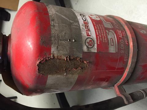 damaged fire extinguisher