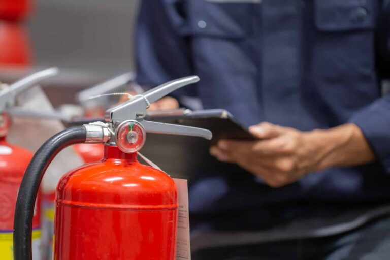 Fire Extinguisher being checked in a business - Fireco