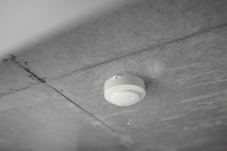 Fire alarm smoke detector on a commercial ceiling